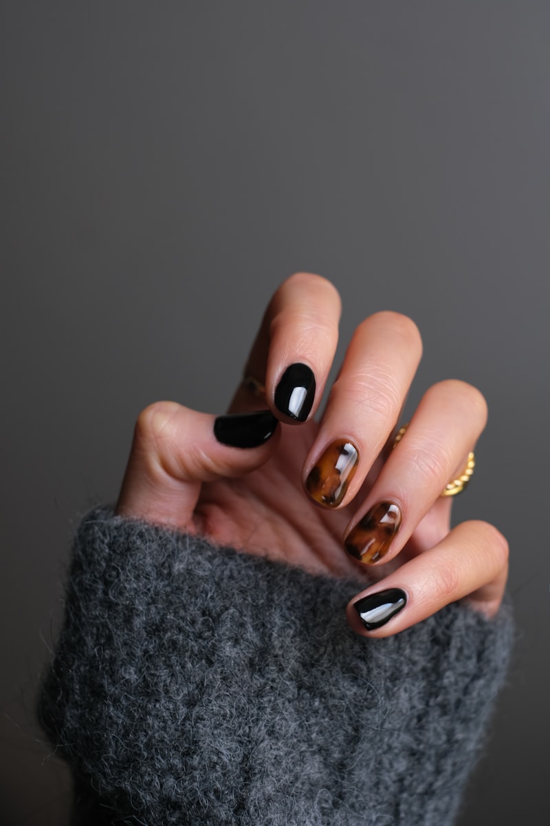 Black and tortoiseshell nail design