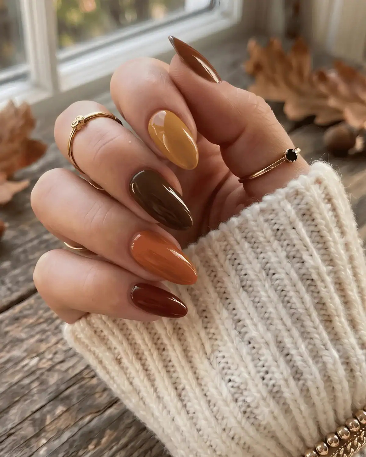 Ombré nails gradient from chocolate brown to pumpkin orange